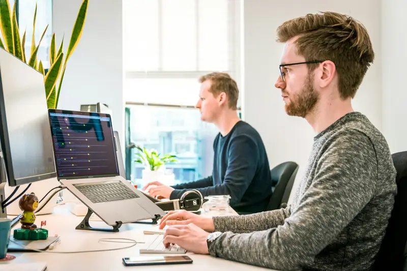 Engineers reviewing code together