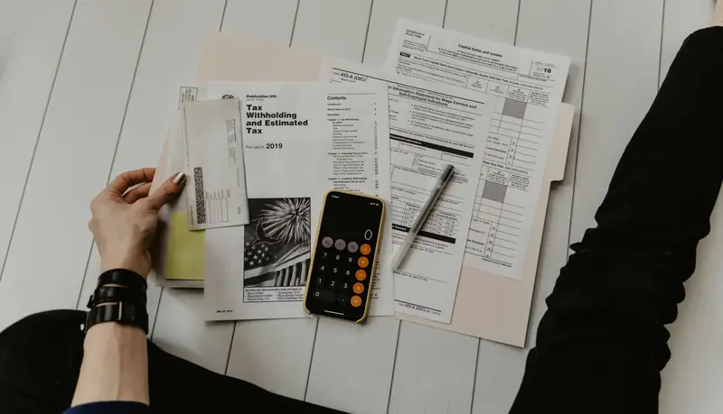 Invoices and tax forms with a calculator