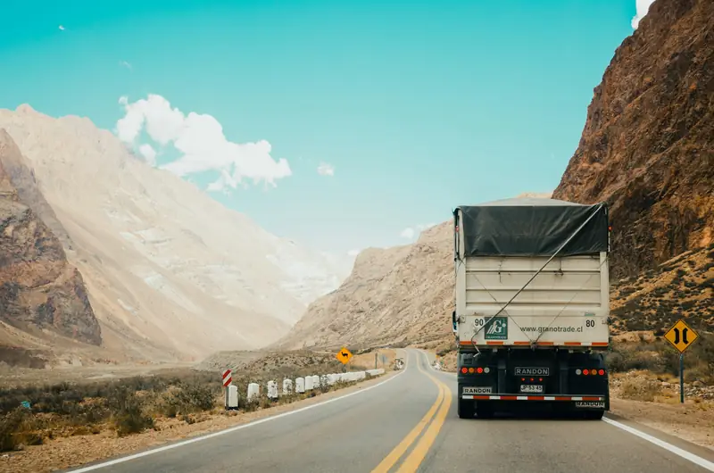 Truck driving along a mountain highway